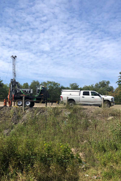 Pick-up truck and drilling rig on side of an Ontario highway