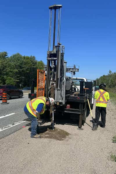 Geotechnical drilling rig on side of busy Ontario highway