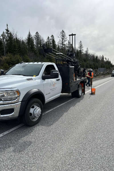 Truck mounted geotechnical drilling rig at a pavement study on an Ontario highway